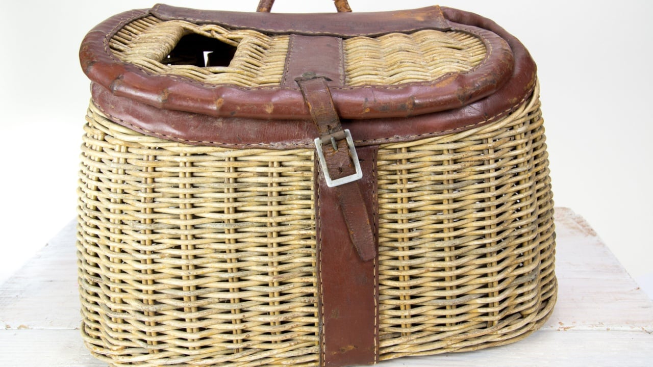 Vintage wicker and leather fishing creel.