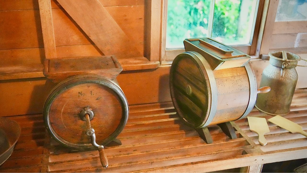 Two butter churns and a cream can at the The Elms - Formerly the Te Papa Mission Station.