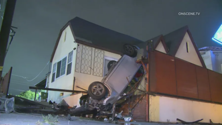 A Vehicle Ended Up Vertical Against a Wilmington Porch After Hitting a Pole and Two Fences