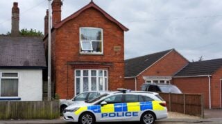police car outside suburban house
