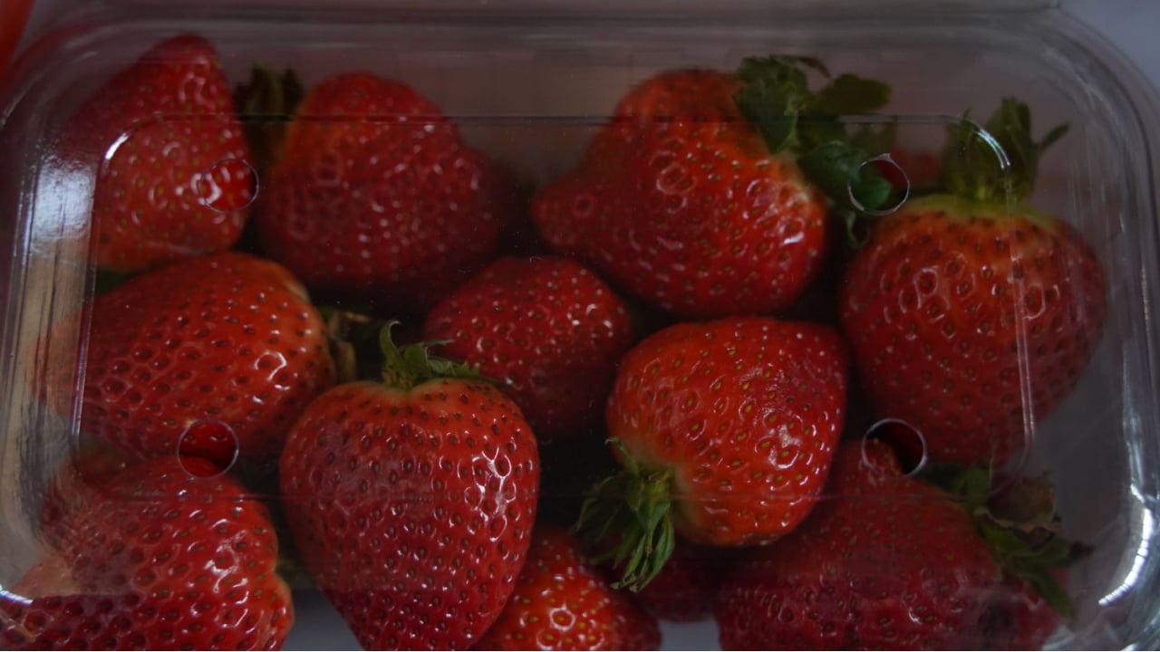 Almaty, Kazakhstan - 03.25.2022 : Strawberries are laid out in containers.