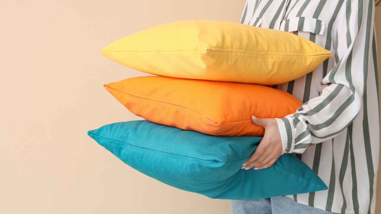 Woman with bright pillows on beige