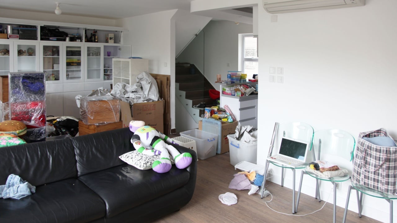 Clear Water Bay, Hong Kong, Asia - 01 21 2012 : interior photo view of a house home flat appartment with white wall during a removal moving in with carboard boxes belongings room new removing property