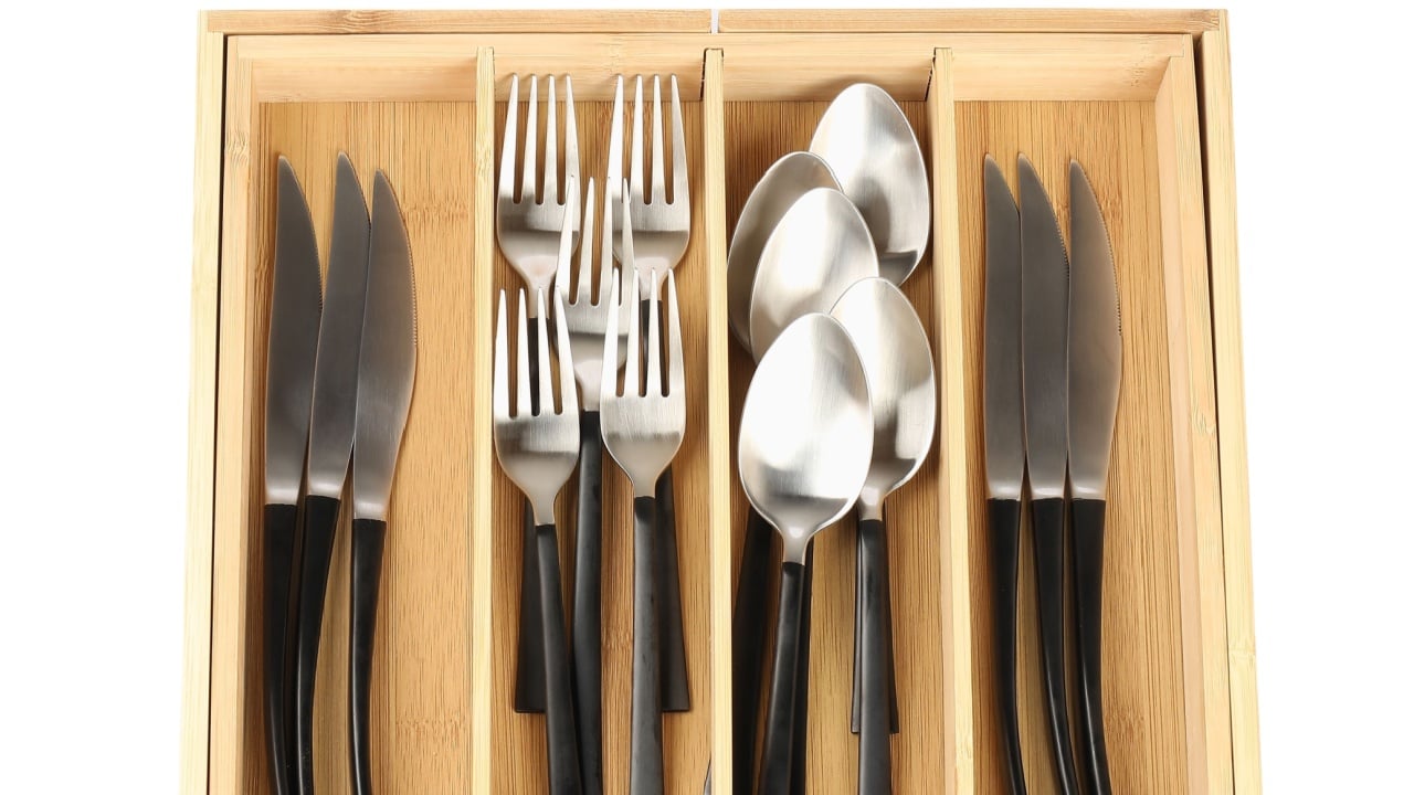 Wooden box with cutlery isolated on white, top view