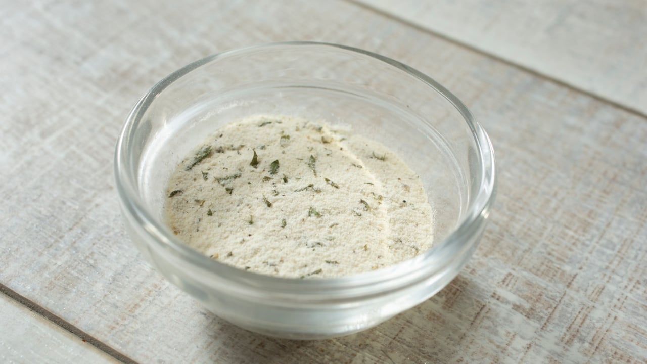 A view of a condiment cup of ranch dressing powder.