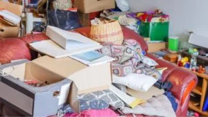 Hoarder's living room is filled with possessions. Hoarding disorder is a mental health problem. The homeowner doesn't want to let go of anything, not even trash. All logos and texts have been removed!
