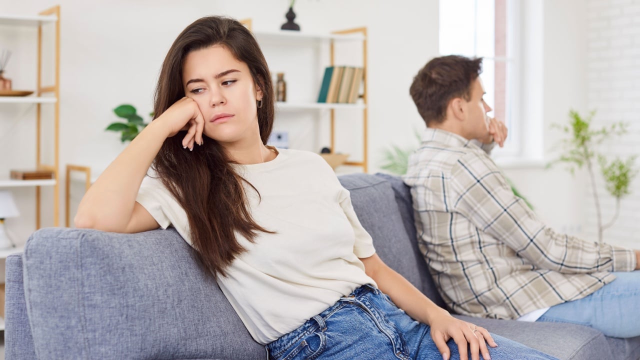 Unhappy frustrated couple at home, wife feeling sad with husband, upset woman depressed and disappointed in marriage, not talking with boyfriend, life problems, thinking of breaking up, get divorced