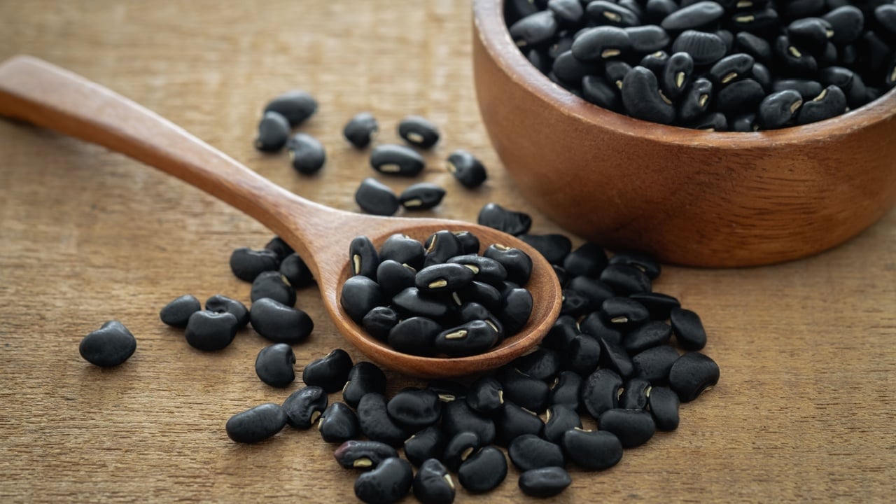 Black bean on wooden spoon