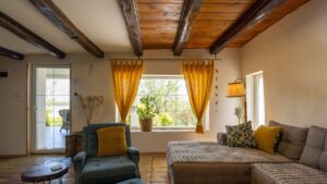 Rustic interior of a cozy rental cabin room with a floor made of old tiles
