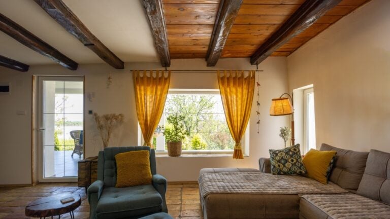 Rustic interior of a cozy rental cabin room with a floor made of old tiles