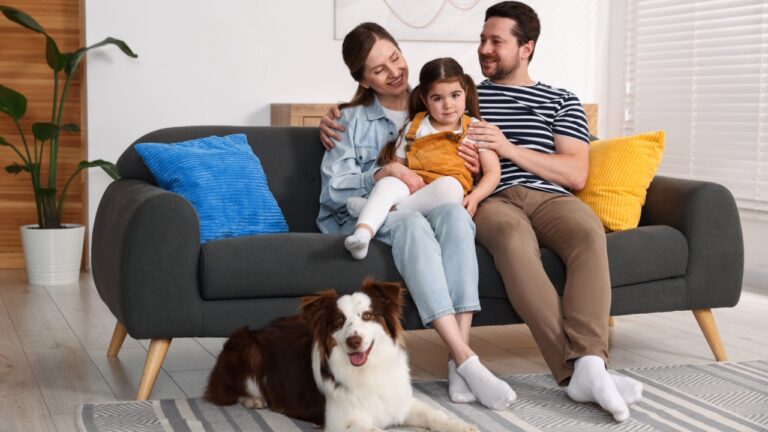 Happy family and their dog at home