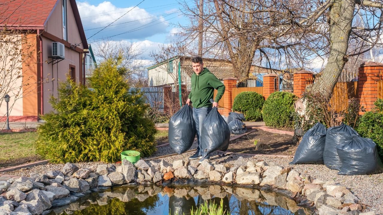 man cleaning a garden