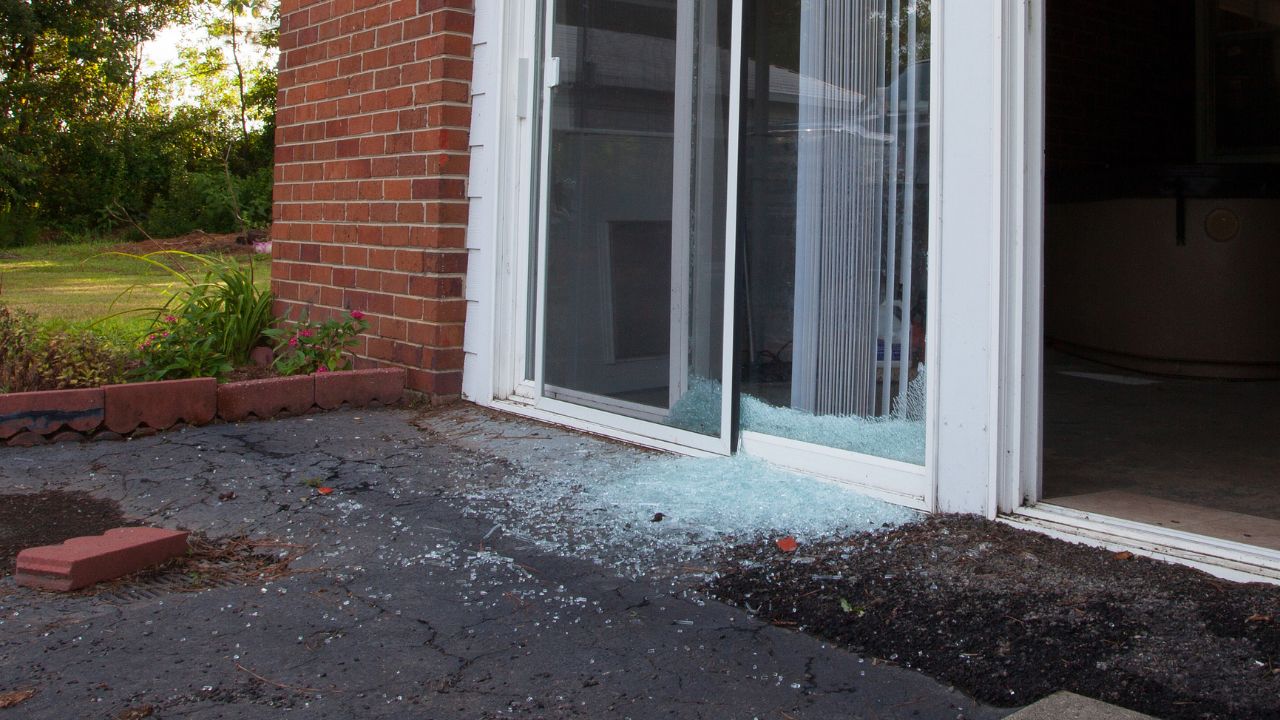 Shattered sliding glass window the morning after a home invasion