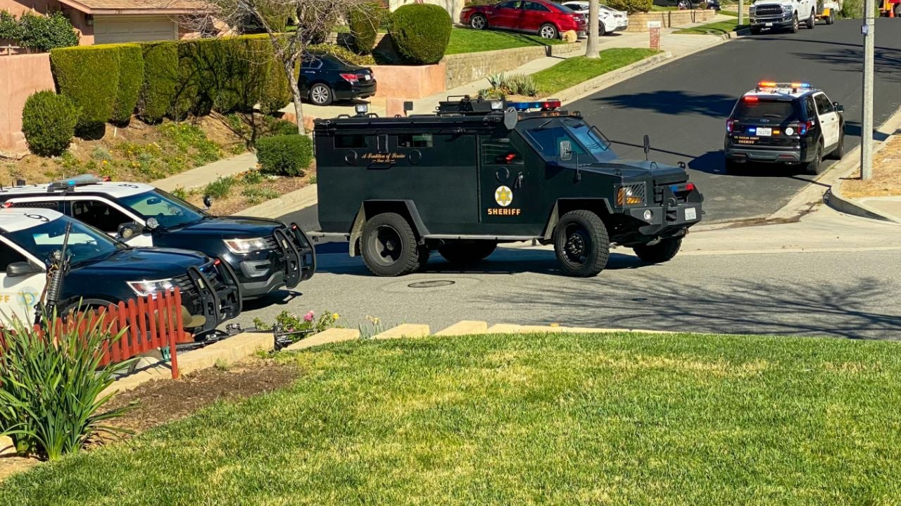 Santa Clarita, Saugus, California. 2026 March 4. Los Angeles Sheriff's Department patrol and SWAT team respond with armor vehicle for a reported shooter barricaded in home in residential neighborhood.