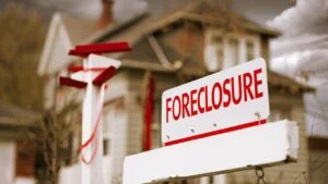 Close-up Foreclosure Real Estate Sign in Front of House