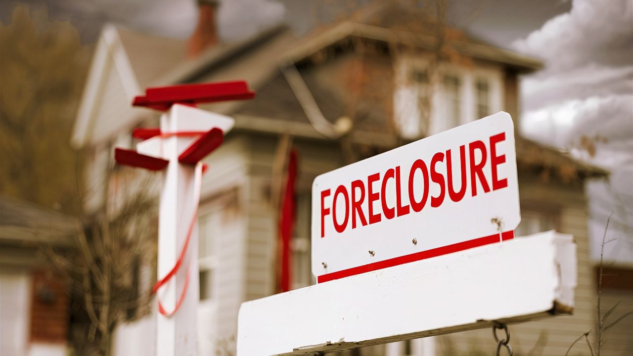 Close-up Foreclosure Real Estate Sign in Front of House