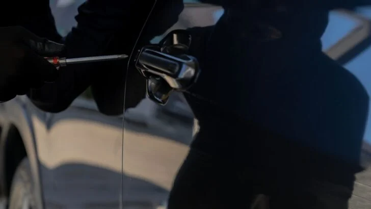 Residents Saw Masked People Breaking Into Cars. Police Later Found Stolen Property in a Sedan