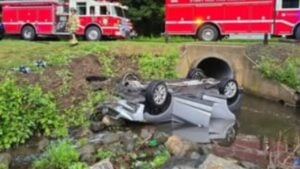 a vehicle overturned into a river
