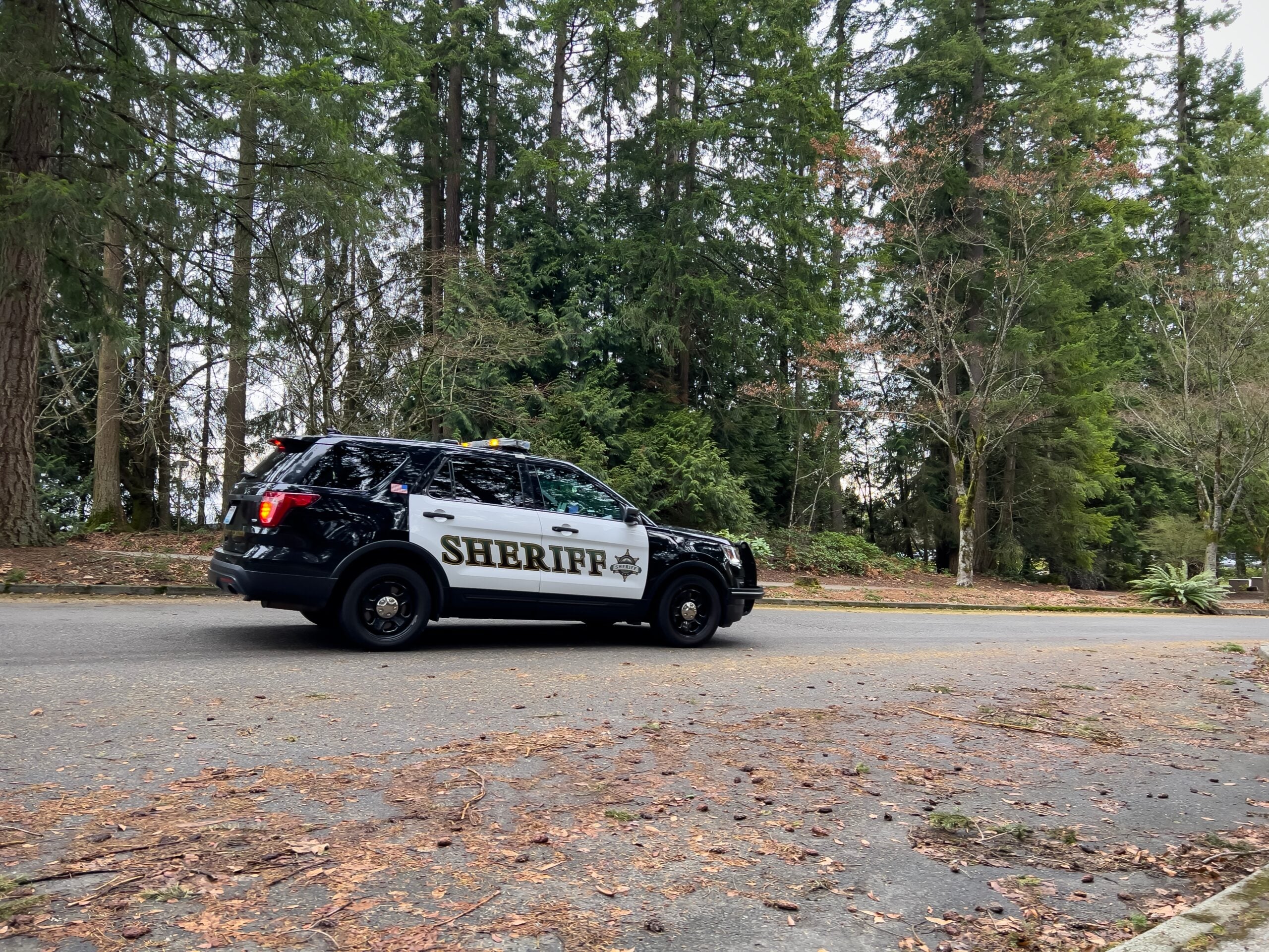 Sheriff patrol vehicle on a rural road