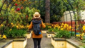 A woman walking through a beautiful botanical garden, a sustainable tourism concept in Arucas, Gran Canaria. Spain