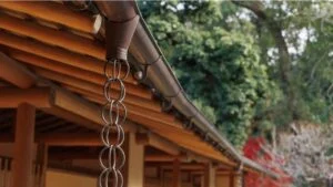 Japanese style bamboo wooden weave ceiling roof eaves rain gutter and rain chain, Kusaritoi traditional architecture design.