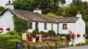 LAKE DISTRICT, ENGLAND - AUGUST 25, 2016: Old stone inn in Lake District National Park, England, United Kingdom