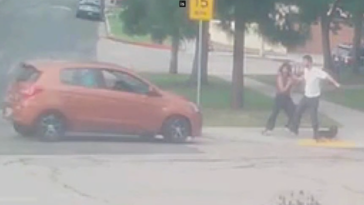 Man Drives Toward a Couple Walking Their Dog After a Strange Exchange
