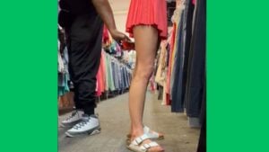 woman films man trying to film up skirt.