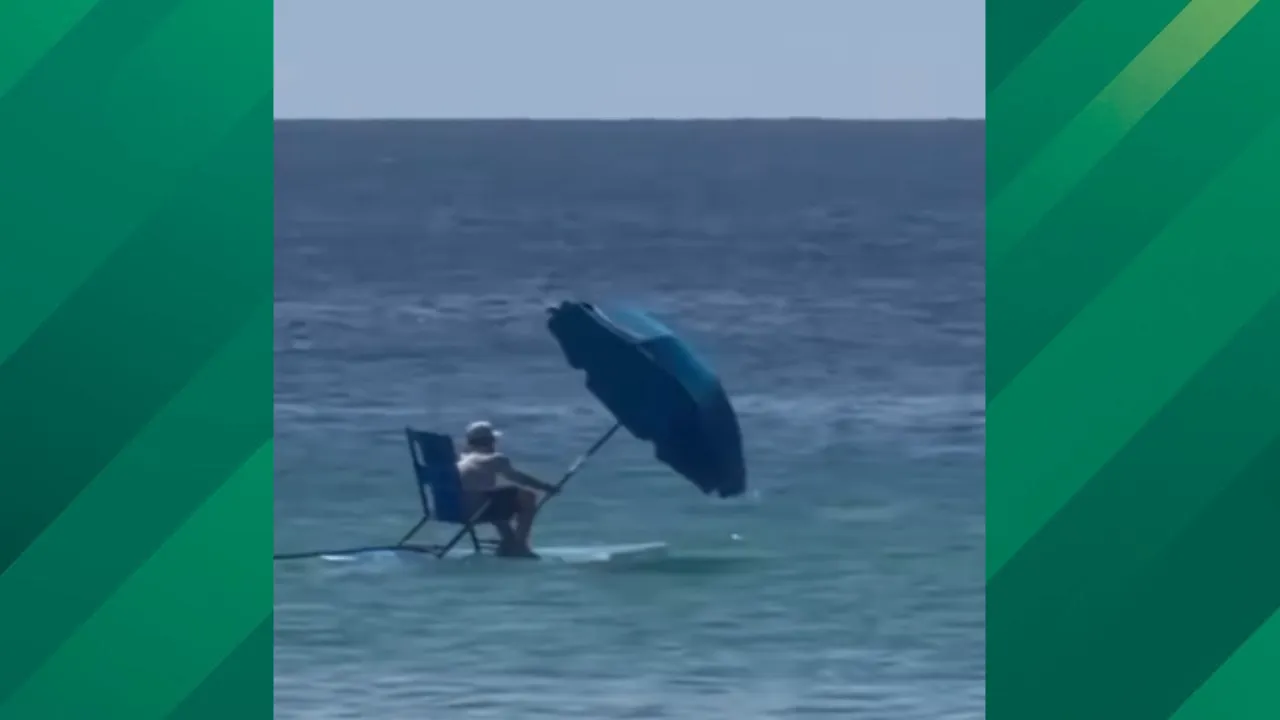 Florida man uses umbrella to sail.