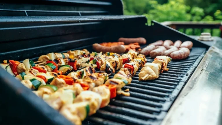 Grilled barbecues on black and gray grill.