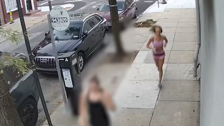 man tries to kick jogging woman.
