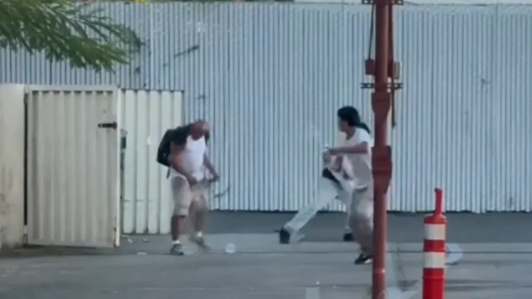 Teens filmed throwing water at homeless people.