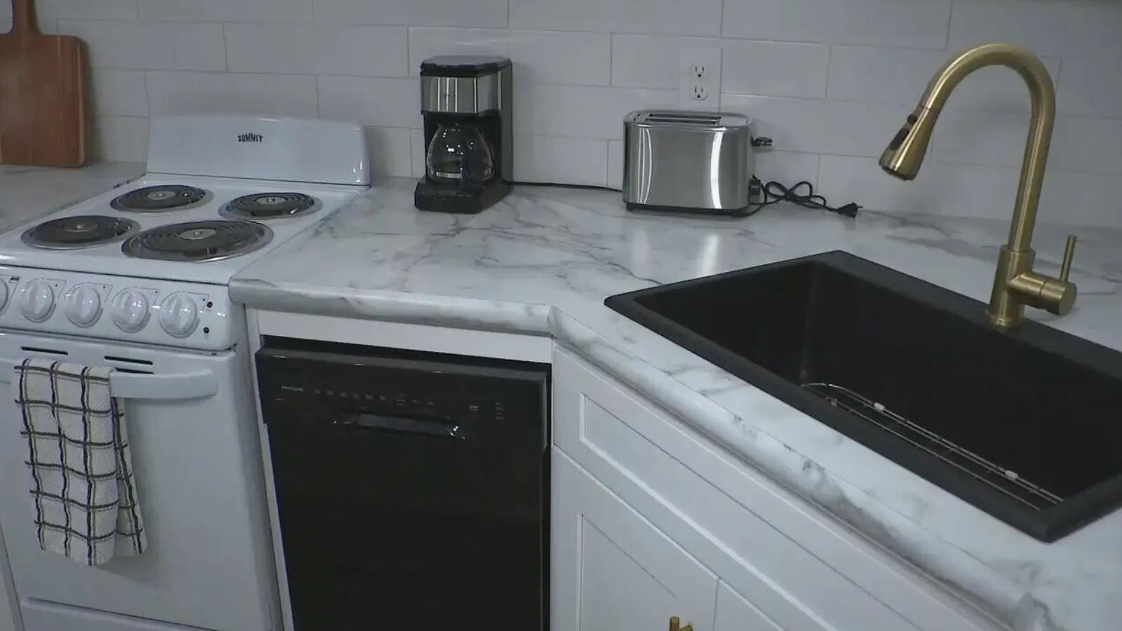Woman says power surge fried appliances.