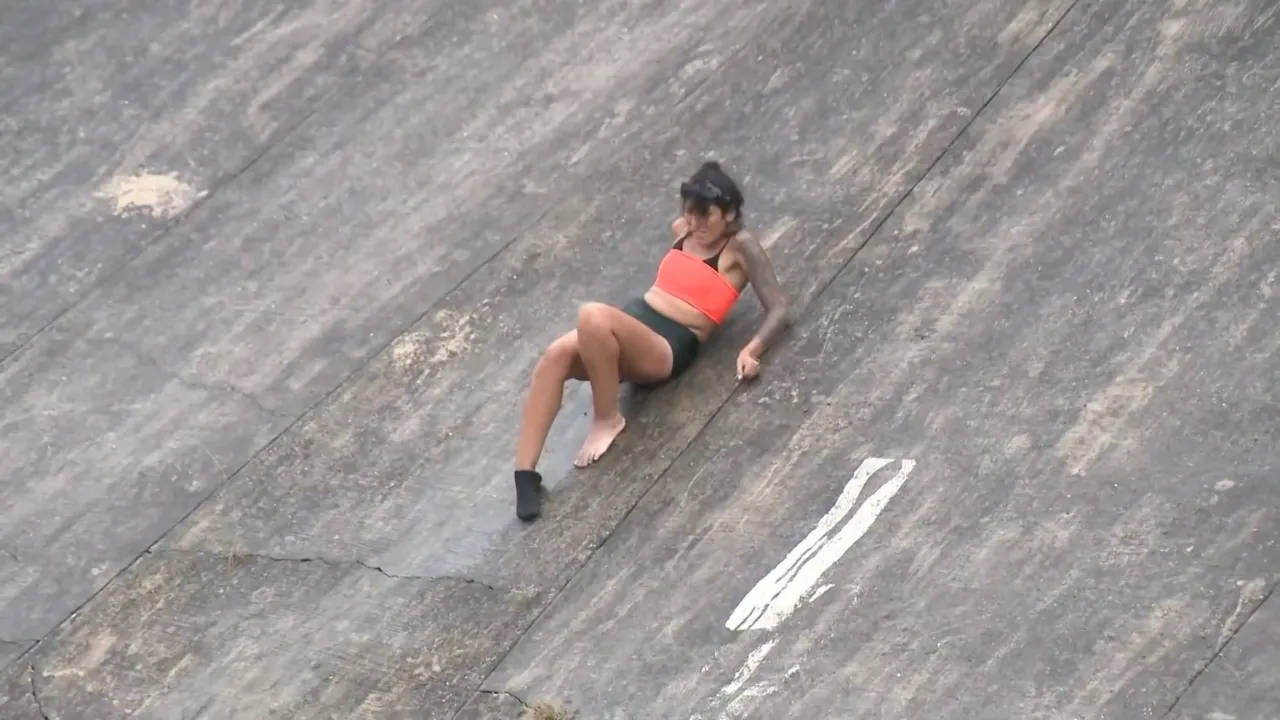 Dramatic video shows firefighters rescue woman swept down San Antonio canal.