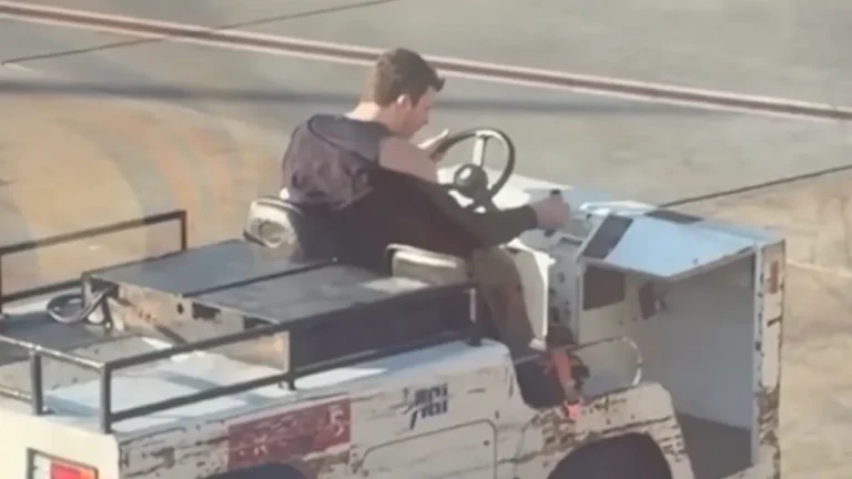 Passenger arrested after stolen airport tug crashes near gate.