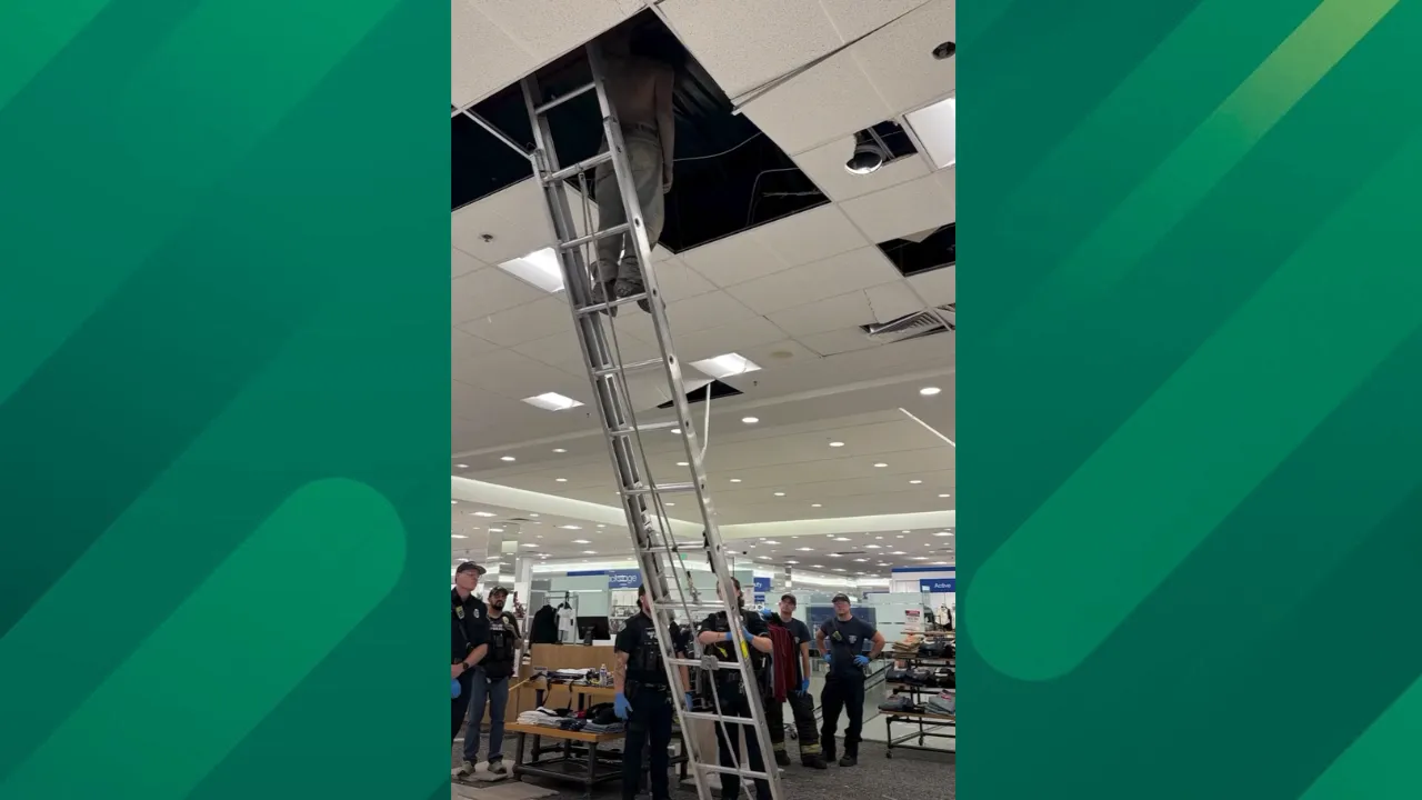 Man crawls through Vancouver mall store ceiling.