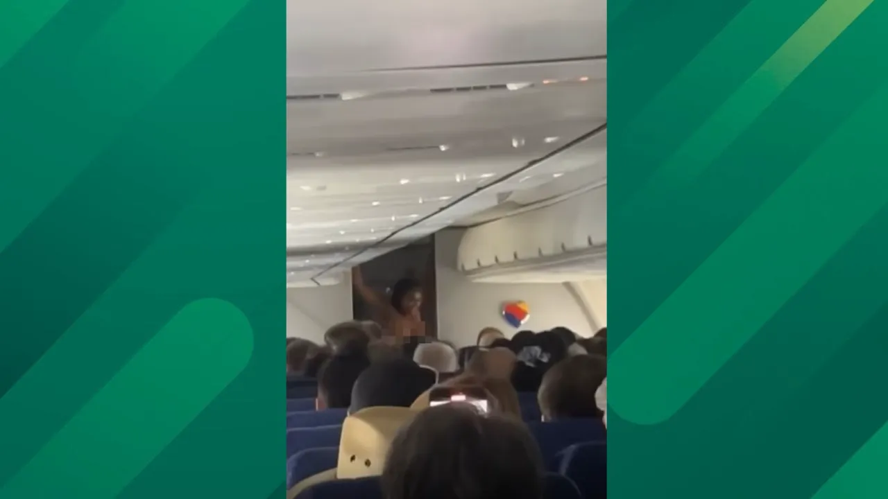 Southwest passenger strips on plane.