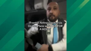 Flight Attendant Wrestles a Woman After Frontier Passengers Get Stuck on Plane After Landing